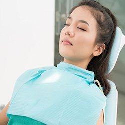 A patient lying in dental chair