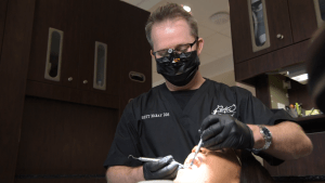 Dr. McRay doing a Dental Implant procedure on a patient